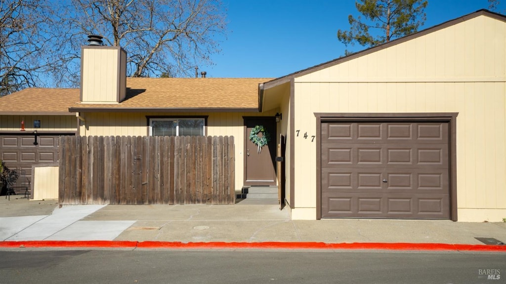 ranch-style home featuring a garage