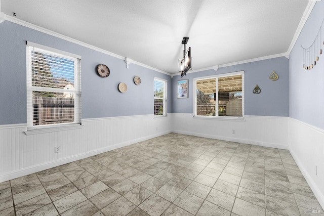 unfurnished dining area with crown molding