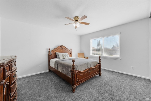 bedroom with dark colored carpet and ceiling fan