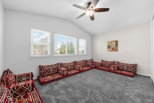 carpeted living room with vaulted ceiling and ceiling fan