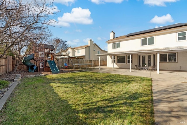 view of yard with a playground and a patio area