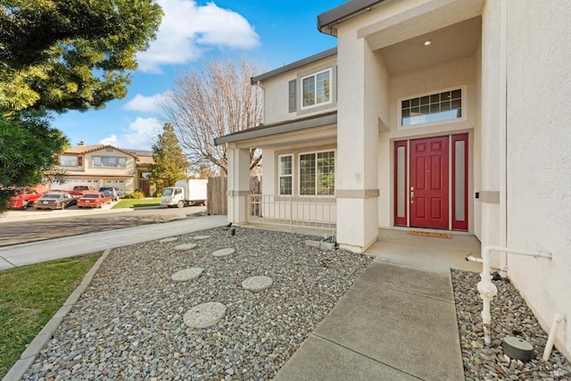 entrance to property featuring covered porch