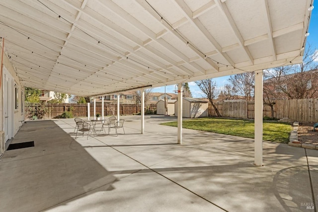 view of patio featuring a shed