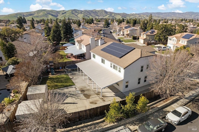 birds eye view of property with a mountain view