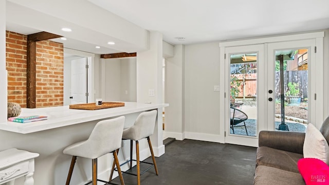 kitchen featuring a kitchen breakfast bar and french doors