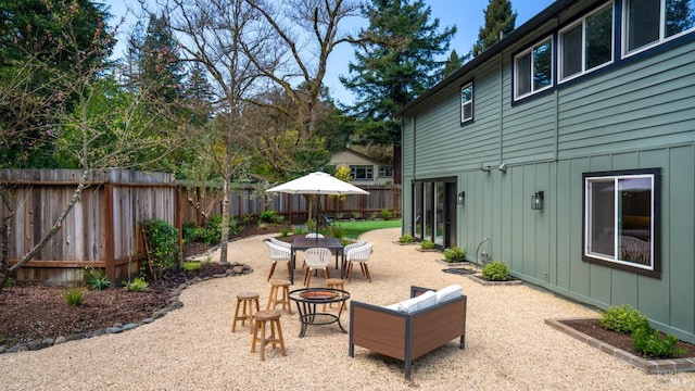 view of patio with a fire pit