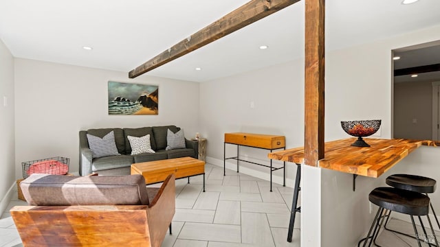 living room featuring beam ceiling