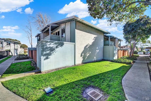 view of property exterior featuring a yard