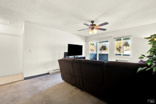 carpeted living room featuring ceiling fan, a baseboard heating unit, and a textured ceiling