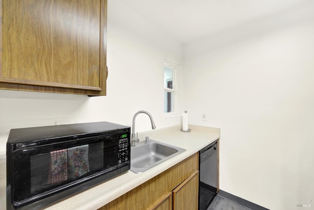 kitchen with sink and black appliances