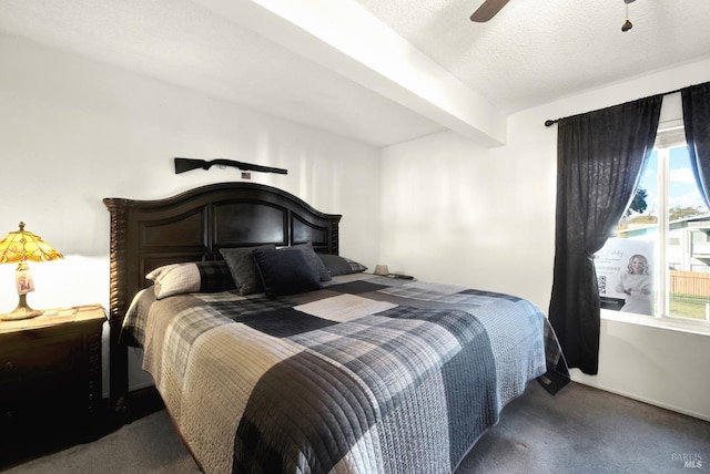 carpeted bedroom featuring ceiling fan, beam ceiling, a textured ceiling, and multiple windows