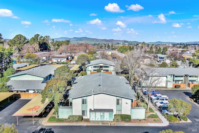 birds eye view of property featuring a mountain view