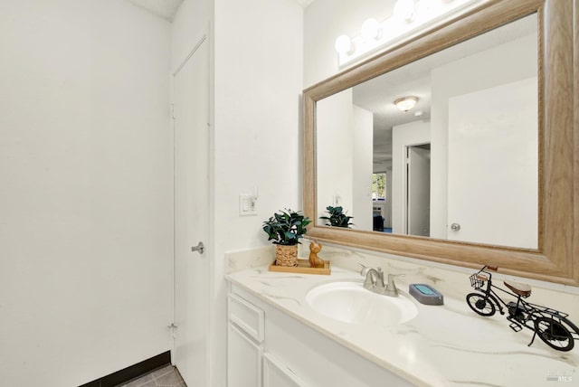 bathroom with vanity and tile patterned flooring