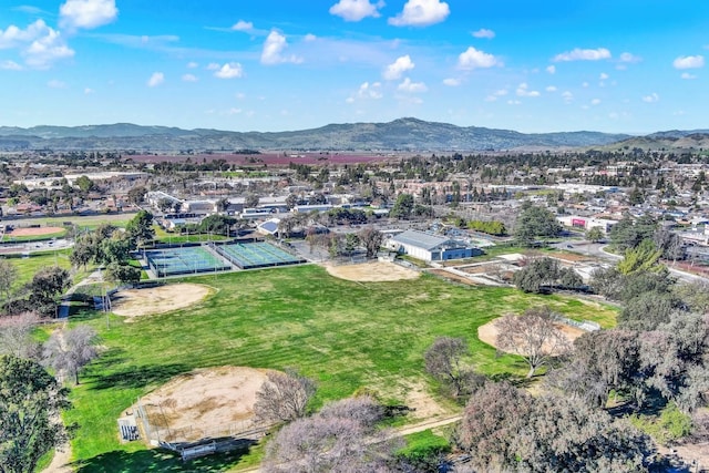 birds eye view of property featuring a mountain view