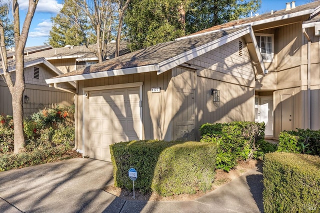 view of property exterior with a garage