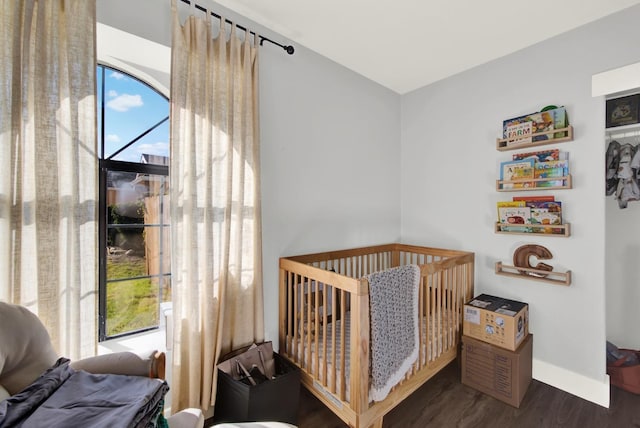 bedroom featuring dark hardwood / wood-style flooring