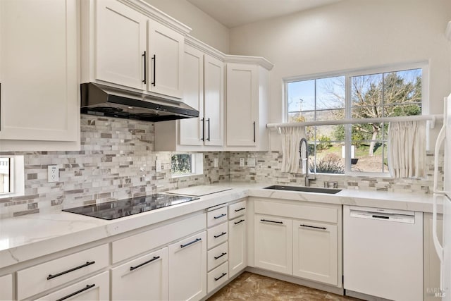 kitchen featuring tasteful backsplash, dishwasher, sink, white cabinets, and black electric cooktop