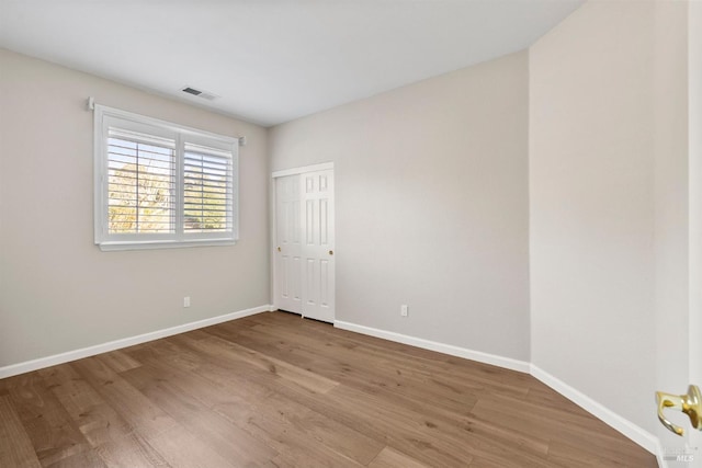 empty room featuring hardwood / wood-style flooring