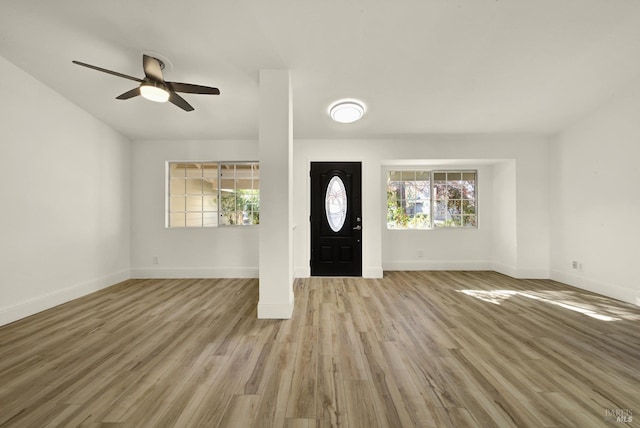 entryway with ceiling fan and light wood-type flooring