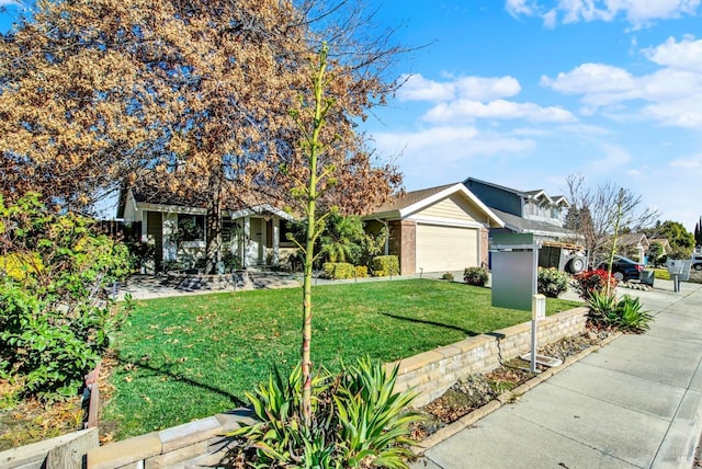 view of front of home with a garage and a front lawn