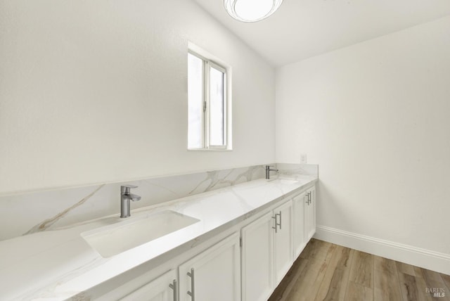 bathroom featuring wood-type flooring and vanity