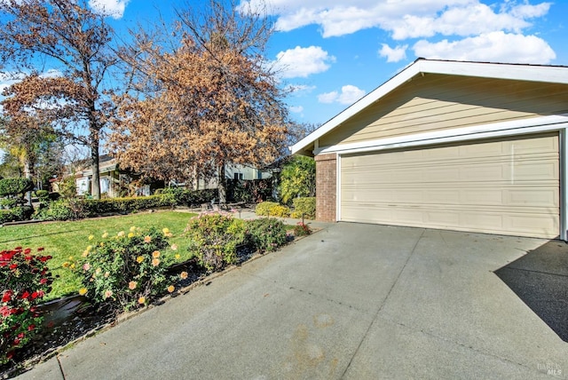 garage with a yard