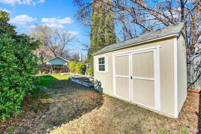 view of outbuilding featuring a lawn