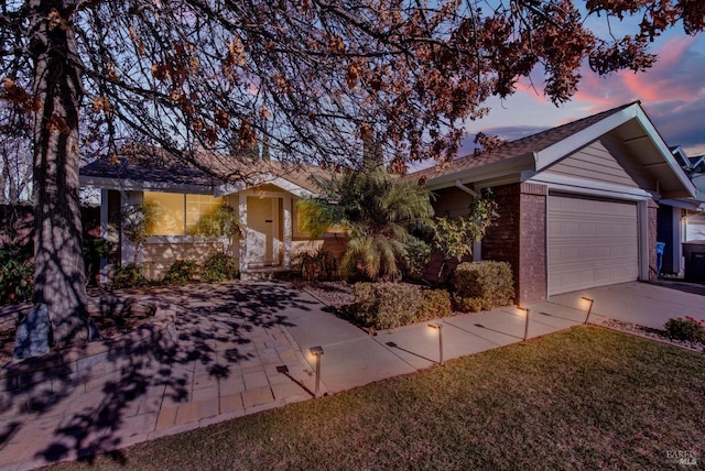 ranch-style home featuring a garage