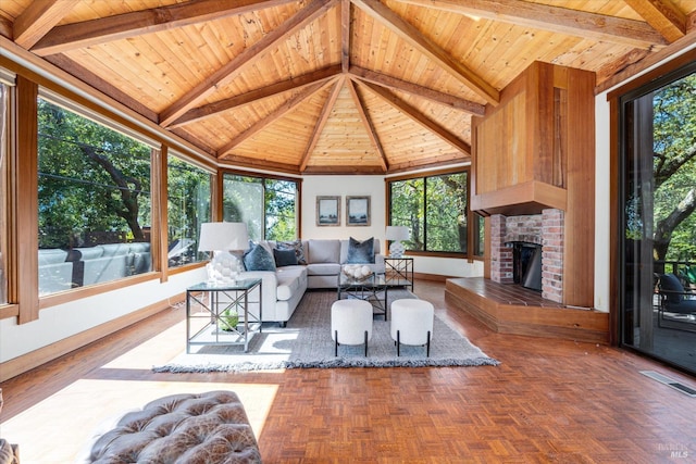 living room with a brick fireplace, wood ceiling, dark parquet flooring, and beamed ceiling