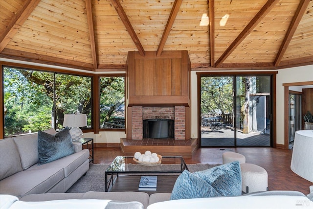 living room featuring a healthy amount of sunlight, beamed ceiling, and wood ceiling