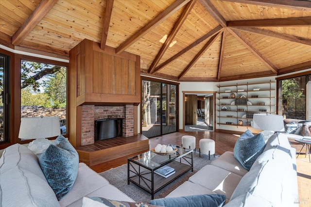 living room with wood ceiling, high vaulted ceiling, a healthy amount of sunlight, and beam ceiling