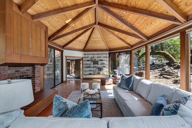 living room with wood ceiling and lofted ceiling with beams