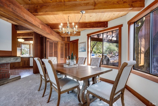 dining room featuring wood ceiling, beamed ceiling, carpet flooring, and an inviting chandelier