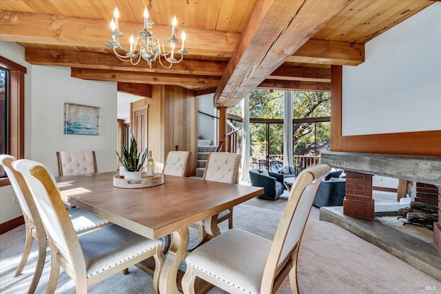 dining room featuring wooden ceiling, a chandelier, light colored carpet, and beamed ceiling