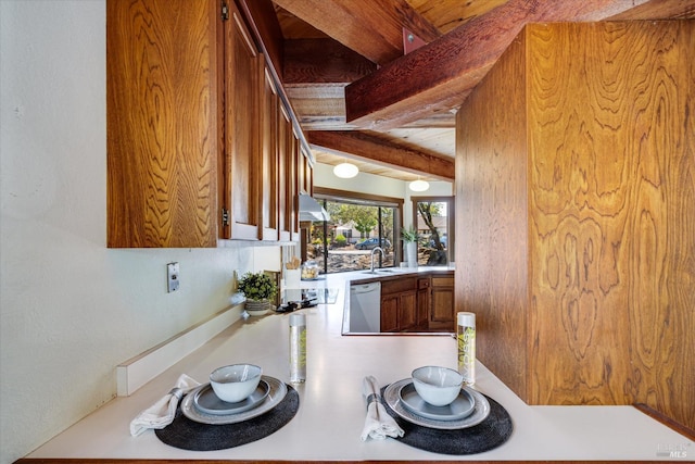 kitchen featuring sink, beam ceiling, ventilation hood, and white dishwasher