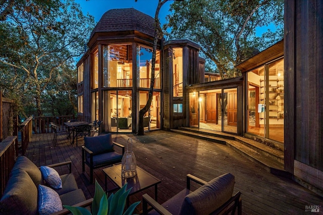 wooden deck featuring an outdoor hangout area