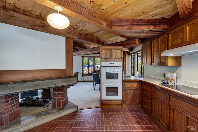 kitchen with a fireplace, wooden ceiling, black electric stovetop, and white double oven