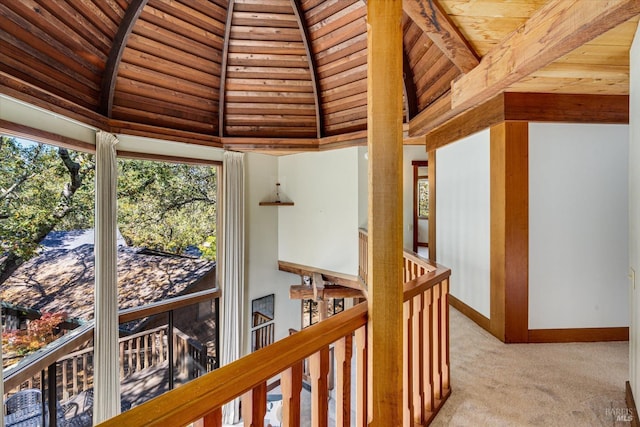 hall featuring light carpet, high vaulted ceiling, beam ceiling, and wooden ceiling