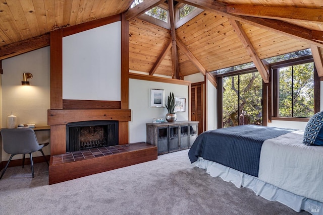 carpeted bedroom with wood ceiling, high vaulted ceiling, beam ceiling, and a tiled fireplace