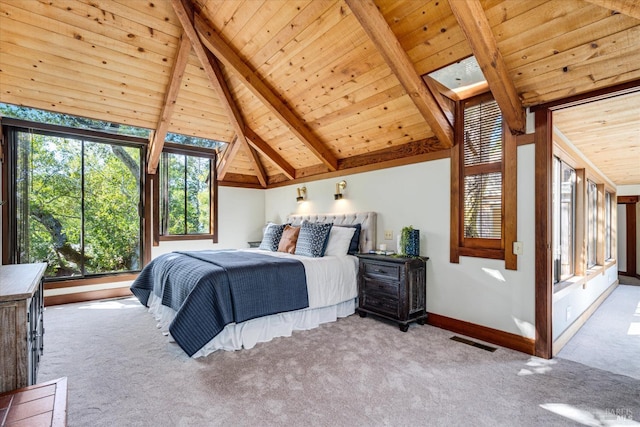 carpeted bedroom featuring lofted ceiling with beams and wood ceiling