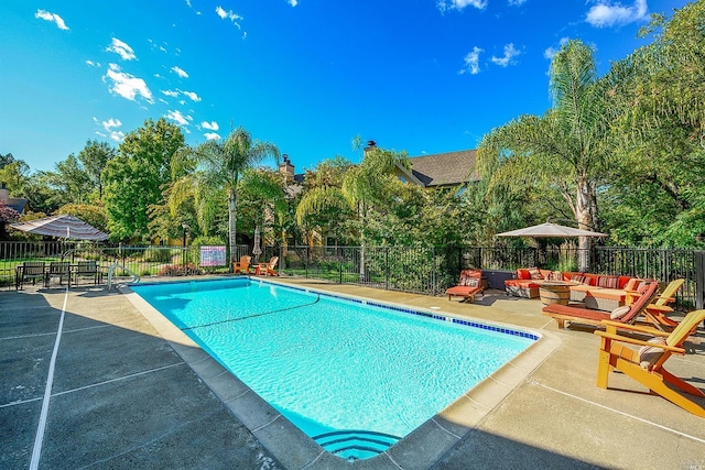 view of pool featuring a patio