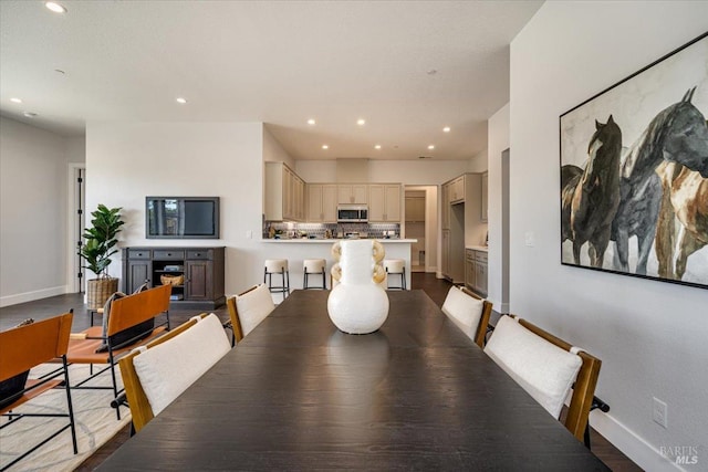 dining space featuring hardwood / wood-style floors