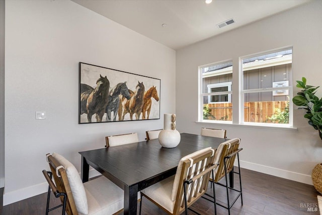 dining area with dark wood-type flooring