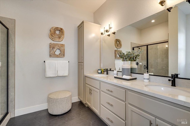 bathroom featuring vanity, tile patterned flooring, and a shower with shower door