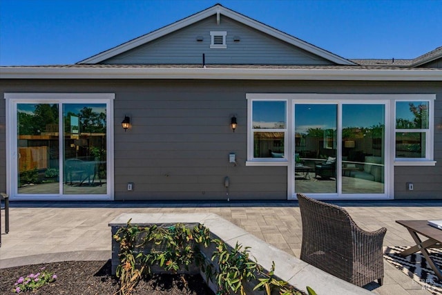 back of house with a patio area