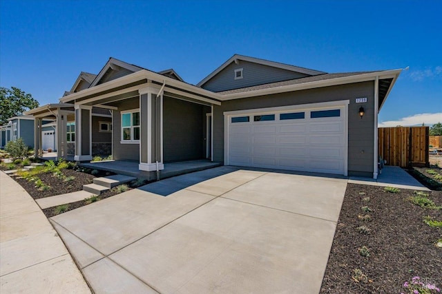 view of front of home with a garage and covered porch