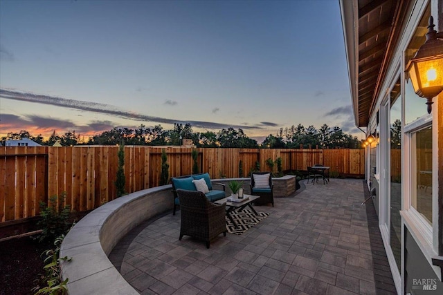 view of patio terrace at dusk