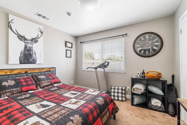 bedroom with light colored carpet