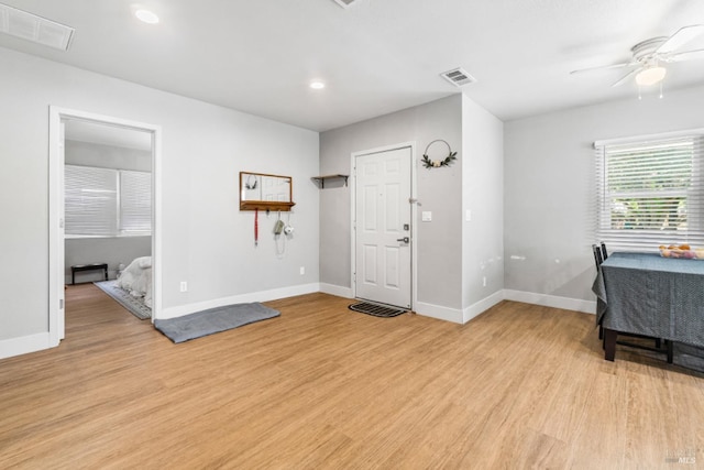 entryway with ceiling fan and light hardwood / wood-style floors