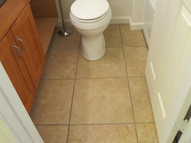 bathroom featuring tile patterned flooring and toilet